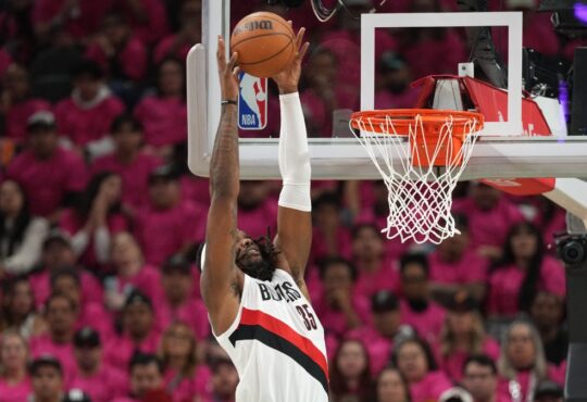 Robert Williams III of the Portland Trail Blazers converts an alley-oop dunk against the San Antonio Spurs in the 2026 NBA Playoffs