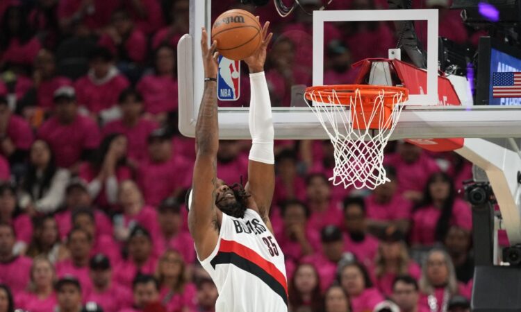 Robert Williams III of the Portland Trail Blazers converts an alley-oop dunk against the San Antonio Spurs in the 2026 NBA Playoffs