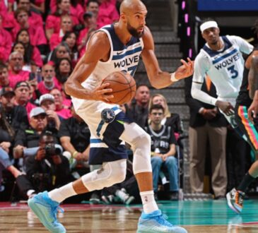 Rudy Gobert #27 of the Minnesota Timberwolves handles the ball against the San Antonio Spurs during Game 1 of the Western Conference Semifinals at Frost Bank Center.