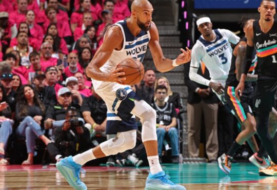 Rudy Gobert #27 of the Minnesota Timberwolves handles the ball against the San Antonio Spurs during Game 1 of the Western Conference Semifinals at Frost Bank Center.