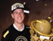 Ryan Schmidt holds the trophy after winning the 2022 CEBL Championship as head coach of the Hamilton Honey Badgers