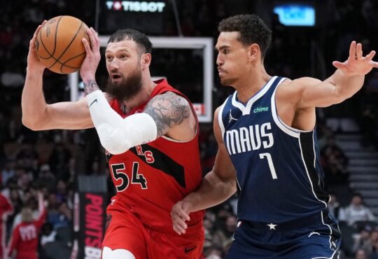 Toronto Raptors forward Sandro Mamukelashvili controls the ball as Dallas Mavericks forward Dwight Powell defends at Scotiabank Arena