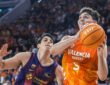 Sergio De Larrea drives to the basket for Valencia Basket against a Barcelona defender in Liga ACB action