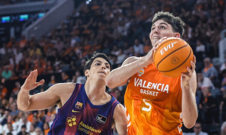 Sergio De Larrea drives to the basket for Valencia Basket against a Barcelona defender in Liga ACB action