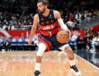 Trae Young #3 of the Washington Wizards handles the ball against the Golden State Warriors at Capital One Arena.