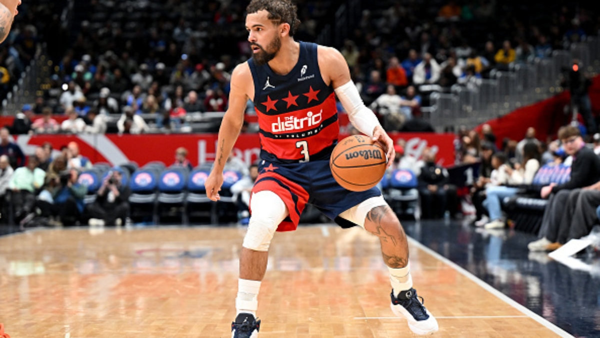 Trae Young #3 of the Washington Wizards handles the ball against the Golden State Warriors at Capital One Arena.