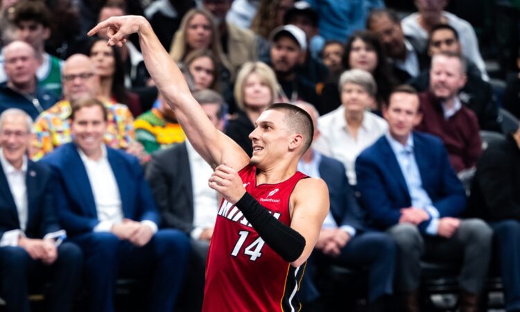 Miami Heat guard Tyler Herro holds his follow-through after a shot during a road game in Dallas during the 2025-26 season