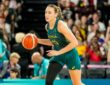 Australia forward Alanna Smith dribbles up the court in a green Opals uniform during the Paris 2024 Olympic semifinal against the United States.