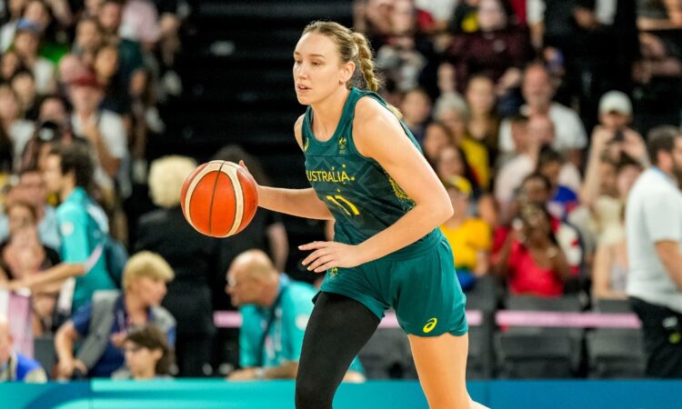 Australia forward Alanna Smith dribbles up the court in a green Opals uniform during the Paris 2024 Olympic semifinal against the United States.