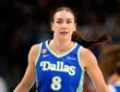 Dallas Wings forward Alanna Smith wears a blue No. 8 jersey while walking up the court during a game against the Chicago Sky at American Airlines Center.