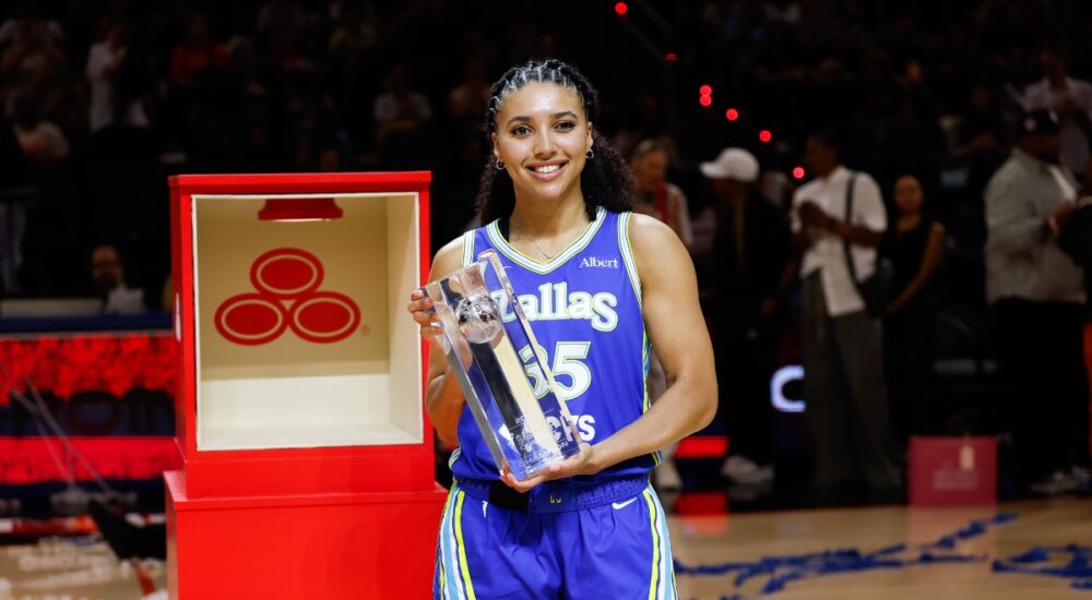 Dallas Wings guard Azzi Fudd holds the 2026 State Farm WNBA 3-Point Contest trophy at Wintrust Arena after the win that prompted her rematch request to Stephen Curry.