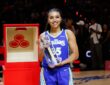 Dallas Wings guard Azzi Fudd holds the 2026 State Farm WNBA 3-Point Contest trophy at Wintrust Arena after the win that prompted her rematch request to Stephen Curry.