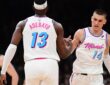 Miami Heat center Bam Adebayo #13 is congratulated by guard Tyler Herro #14 after making a basket against the Boston Celtics at TD Garden.