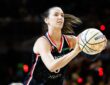 Portland Fire forward Bridget Carleton rises into her shooting motion, holding an All-Star Wilson ball with a rack visible at left, during the 2026 State Farm WNBA 3-Point Contest at Wintrust Arena in Chicago.