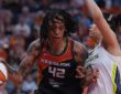 Connecticut Sun center Brittney Griner drives against Dallas Wings center Li Yueru in the second half at PeoplesBank Arena