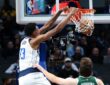 Jamarion Sharp dunks over Liam Robbins during 2024 Mavericks-Bucks preseason game