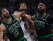 Jayson Tatum #0 and Jaylen Brown #7 of the Boston Celtics look for a rebound against Paul George #8 of the Philadelphia 76ers during Game 5 of the NBA Playoffs at TD Garden.