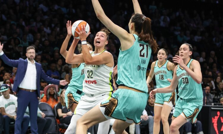 Dallas Wings forward Jessica Shepard drives to the basket against New York Liberty center Han Xu in the first quarter at Barclays Center