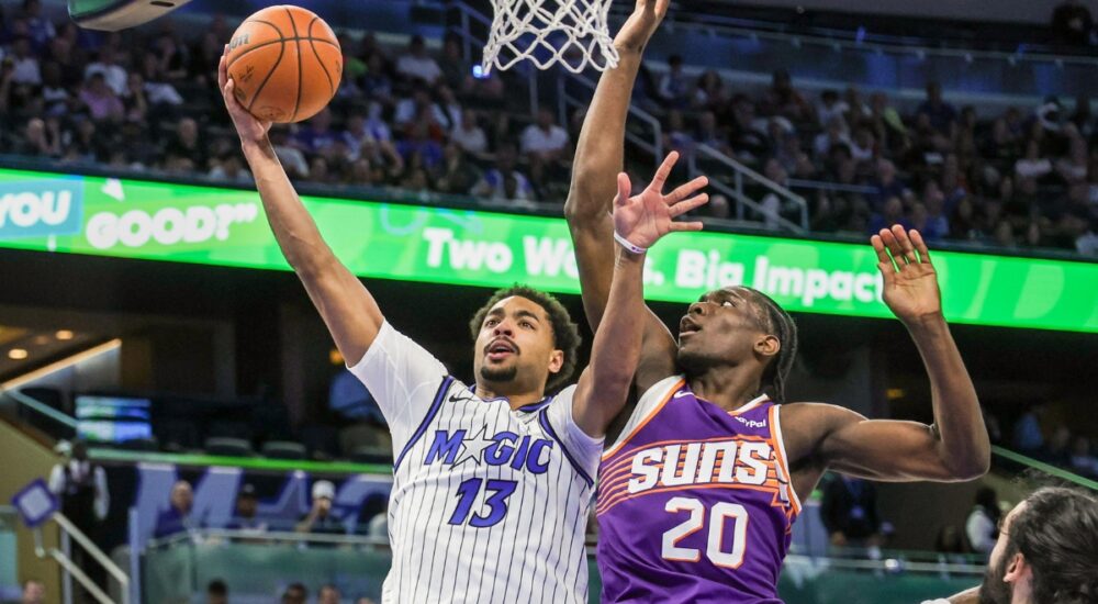 Orlando Magic guard Jett Howard shoots against Phoenix Suns forward Rasheer Fleming at Kia Center