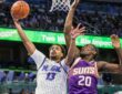 Orlando Magic guard Jett Howard shoots against Phoenix Suns forward Rasheer Fleming at Kia Center