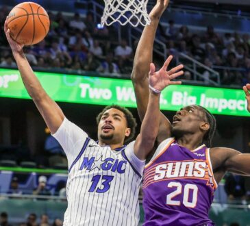 Orlando Magic guard Jett Howard shoots against Phoenix Suns forward Rasheer Fleming at Kia Center