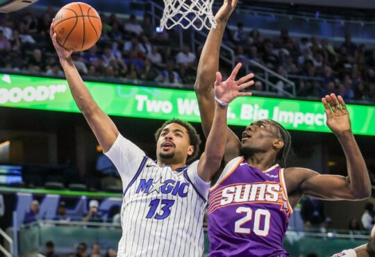 Orlando Magic guard Jett Howard shoots against Phoenix Suns forward Rasheer Fleming at Kia Center