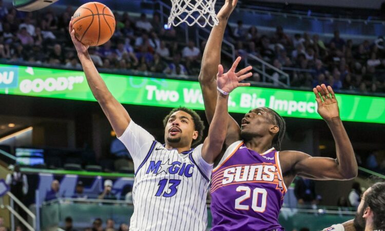 Orlando Magic guard Jett Howard shoots against Phoenix Suns forward Rasheer Fleming at Kia Center