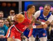 LA Clippers forward John Collins drives against Detroit Pistons guard Ausar Thompson at Little Caesars Arena