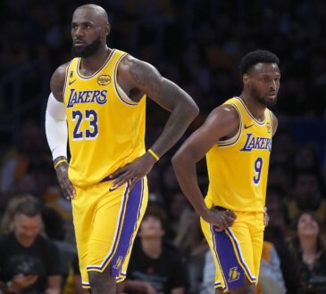 LeBron James #23 and Bronny James #9 of the Los Angeles Lakers during Game 1 of the NBA Playoffs against the Houston Rockets at Crypto.com Arena.