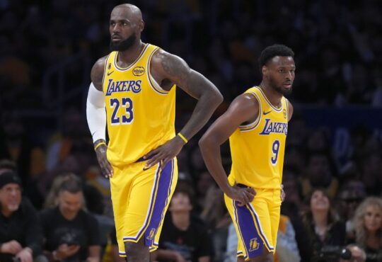 LeBron James #23 and Bronny James #9 of the Los Angeles Lakers during Game 1 of the NBA Playoffs against the Houston Rockets at Crypto.com Arena.