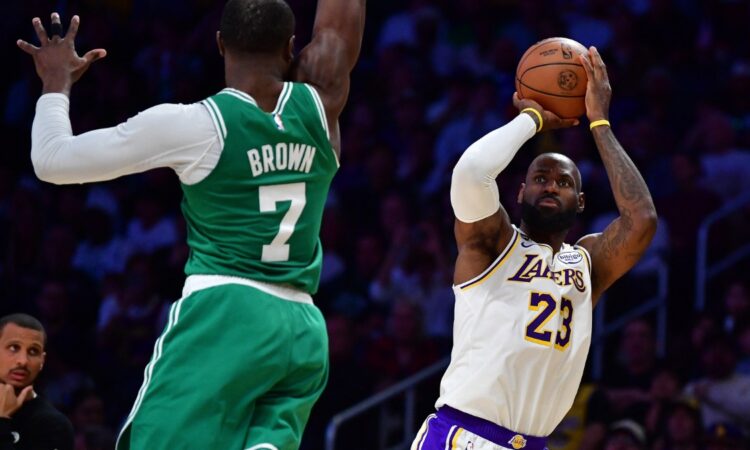Los Angeles Lakers forward LeBron James #23 shoots a jumper against Boston Celtics guard Jaylen Brown #7 at Crypto.com Arena.