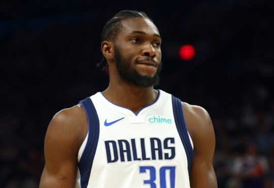Dallas Mavericks center Moussa Cissé in a white No. 30 jersey against the Phoenix Suns