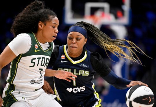 Odyssey Sims of the Dallas Wings drives past Zia Cooke of the Seattle Storm during their WNBA game on June 1, 2026