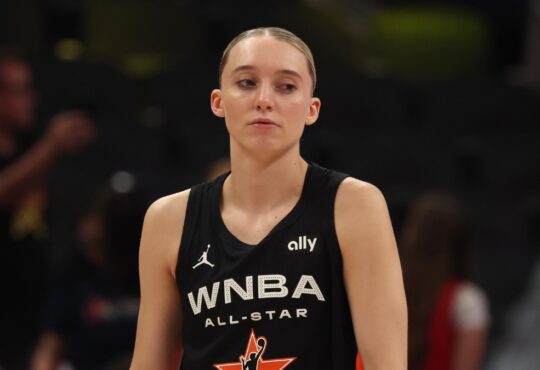 Dallas Wings guard Paige Bueckers stands on the court in her Team Collier All-Star jersey before the 2025 WNBA All-Star Game at Gainbridge Fieldhouse in Indianapolis.