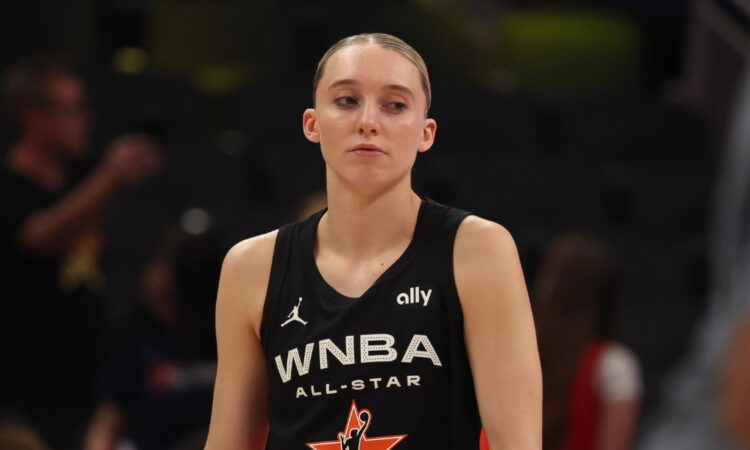 Dallas Wings guard Paige Bueckers stands on the court in her Team Collier All-Star jersey before the 2025 WNBA All-Star Game at Gainbridge Fieldhouse in Indianapolis.