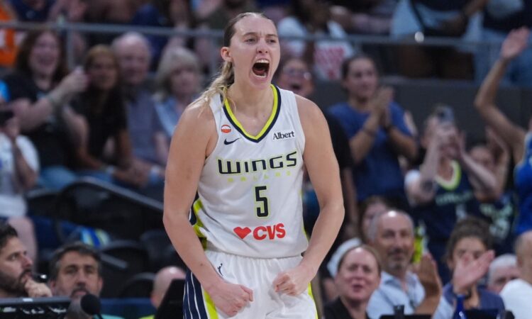 Dallas Wings guard Paige Bueckers reacts after an and-one basket against the Connecticut Sun.