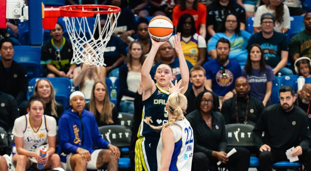 Dallas Wings guard Paige Bueckers (5) elevates for a jump shot over Los Angeles Sparks forward Cameron Brink (22) during Dallas' win over the Sparks on July 19, 2026.