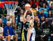 Dallas Wings guard Paige Bueckers (5) elevates for a jump shot over Los Angeles Sparks forward Cameron Brink (22) during Dallas' win over the Sparks on July 19, 2026.