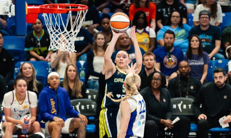 Dallas Wings guard Paige Bueckers (5) elevates for a jump shot over Los Angeles Sparks forward Cameron Brink (22) during Dallas' win over the Sparks on July 19, 2026.