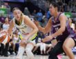 Dallas Wings guard Paige Bueckers controls the ball while Toronto Tempo guard Kia Nurse defends during the second quarter at Coca-Cola Coliseum.