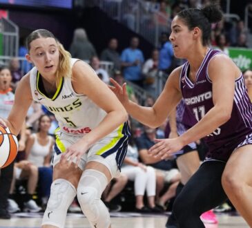 Dallas Wings guard Paige Bueckers controls the ball while Toronto Tempo guard Kia Nurse defends during the second quarter at Coca-Cola Coliseum.