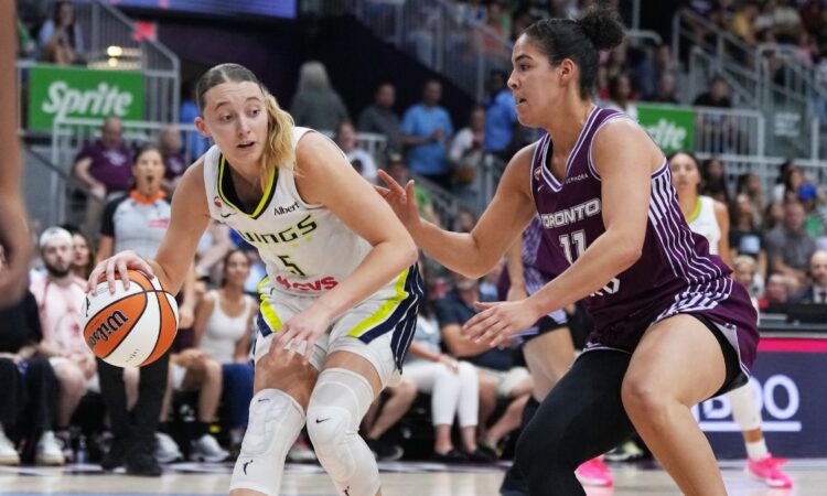 Dallas Wings guard Paige Bueckers controls the ball while Toronto Tempo guard Kia Nurse defends during the second quarter at Coca-Cola Coliseum.