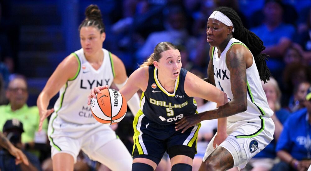 Paige Bueckers of the Dallas Wings drives to the basket against Natasha Howard of the Minnesota Lynx during their WNBA game on June 28, 2026