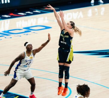 Dallas Wings guard Paige Bueckers #5 shoots over a Los Angeles Sparks defender during a WNBA game at College Park Center in Arlington, Texas.