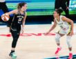 New York Liberty guard Sabrina Ionescu dribbles the ball as Dallas Wings guard Azzi Fudd defends during their game at College Park Center.
