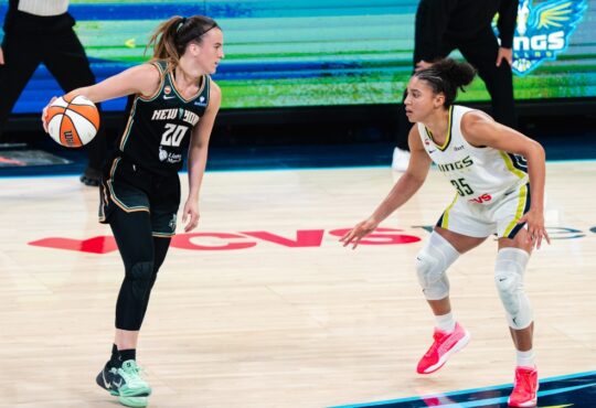 New York Liberty guard Sabrina Ionescu dribbles the ball as Dallas Wings guard Azzi Fudd defends during their game at College Park Center.