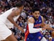 Detroit Pistons forward Tobias Harris drives with the ball against Cleveland Cavaliers center Evan Mobley during a 2026 NBA Playoffs game.
