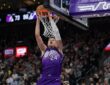 Utah Jazz center Walker Kessler dunks over Los Angeles Lakers forward LeBron James at Delta Center
