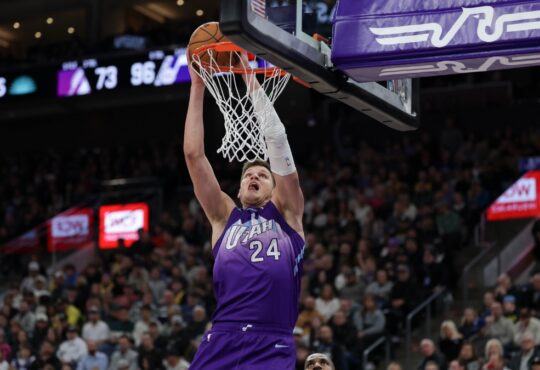 Utah Jazz center Walker Kessler dunks over Los Angeles Lakers forward LeBron James at Delta Center